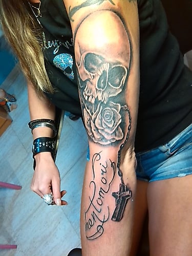 Skull tattoo and cross